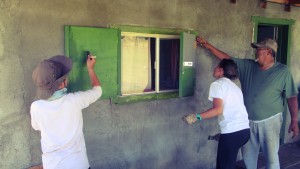 Deer Hill group helps with a window at service