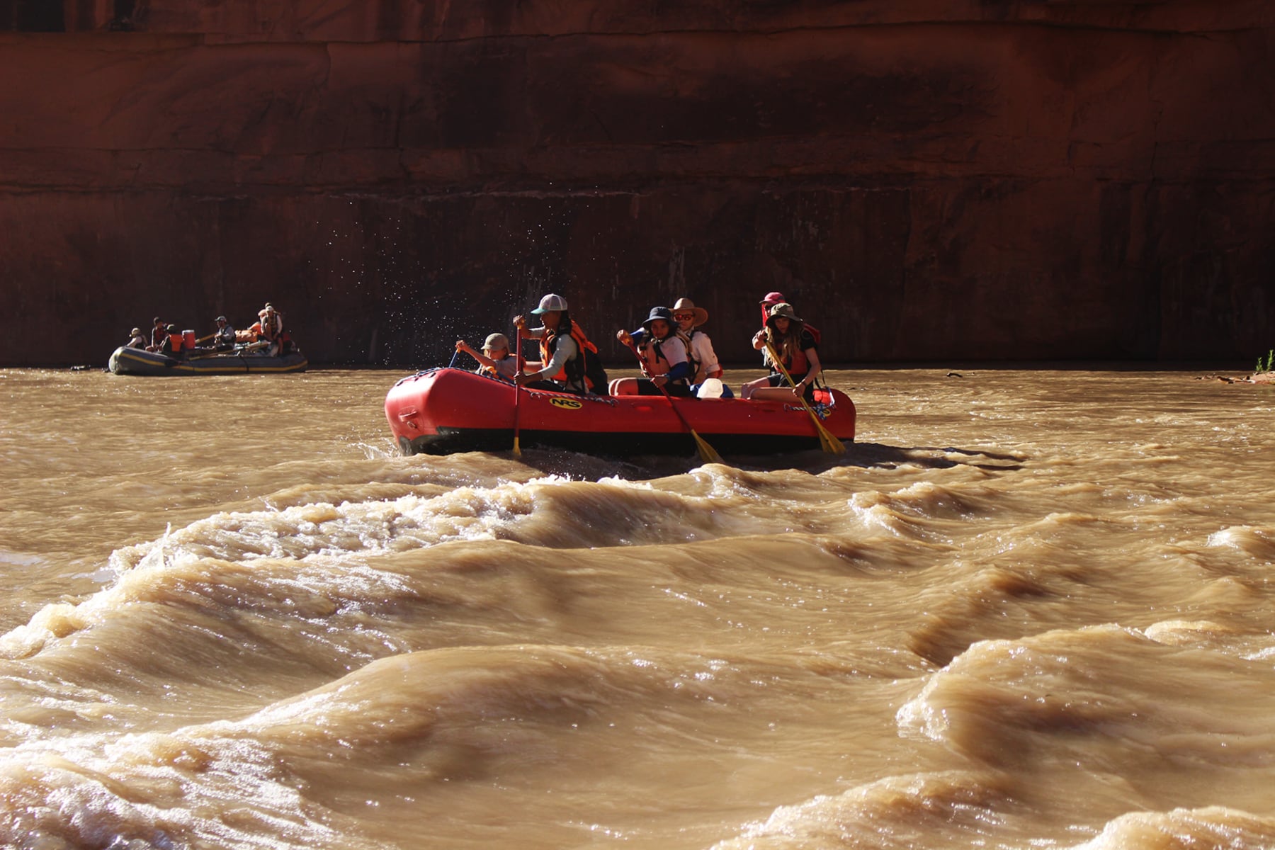 A group paddles out one of the lesser rapids