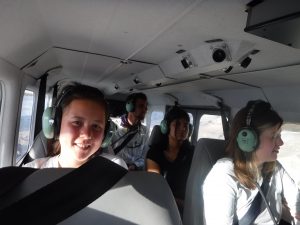 Deer Hill participants inside the Cessna