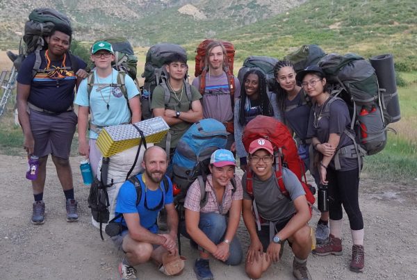 group of teens at outdoor camp in colorado
