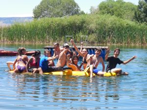 Deer Hill participants swim in pond at base camp