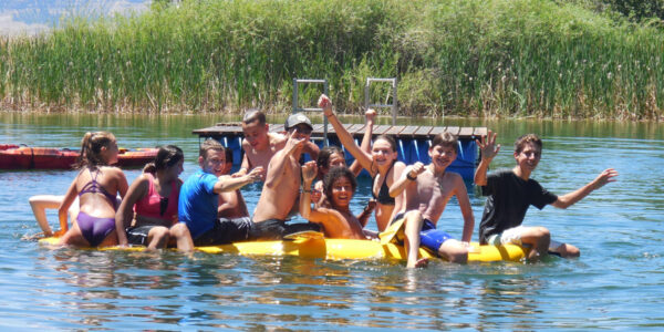 Deer Hill participants swim in pond at base camp