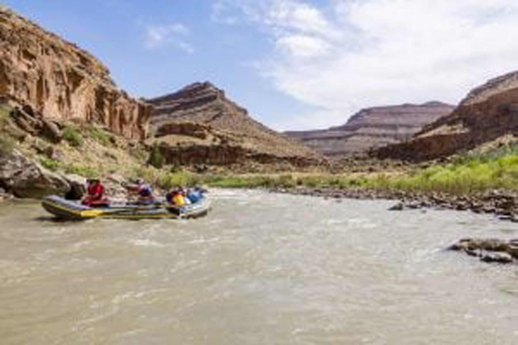 Participants work as a team on the river