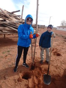 Participants at service digging