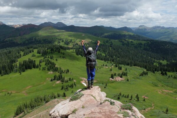 teen in colorado celebrating summer camp