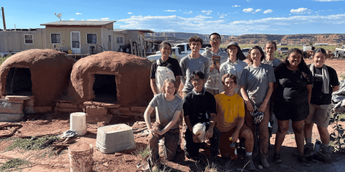 Students participating in a service learning program, working alongside Indigenous community partners in the Southwest.